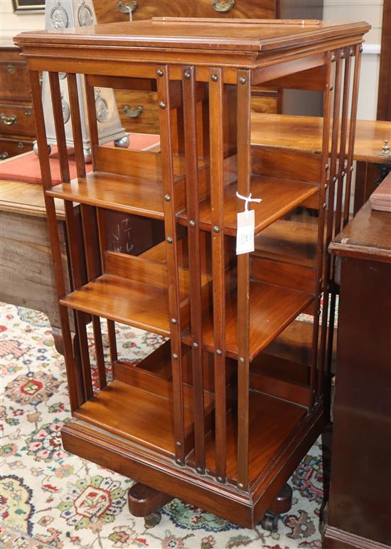 A Harrods walnut revolving bookcase with ratchet top H.110cm